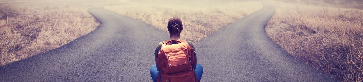 Female student in front of two paths