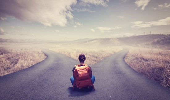 Female student in front of two paths