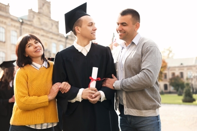 Photo of parents and their son at his college graduation