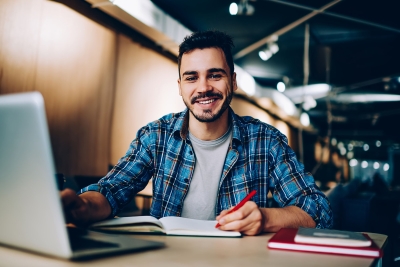 Male college student at the library