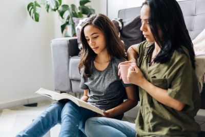 Mother with daughter reading