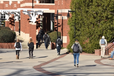 Photo of students walking around college campus