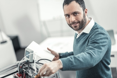 Male technician smiling