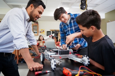 Male teacher with students