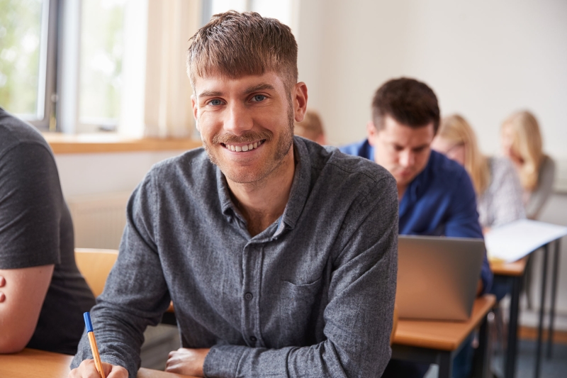 Male adult student in classroom.